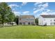 Two story home featuring vinyl siding, a well maintained lawn and sliding glass doors at 2013 Arbor Crest Ct, Charlotte, NC 28262