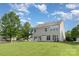Two story home featuring vinyl siding, a well maintained lawn and sliding glass doors at 2013 Arbor Crest Ct, Charlotte, NC 28262