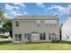 Two story home featuring vinyl siding, a well maintained lawn and sliding glass doors at 2013 Arbor Crest Ct, Charlotte, NC 28262