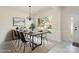 Bright dining room with a modern table set and a large window offering a view of the outdoors at 2013 Arbor Crest Ct, Charlotte, NC 28262