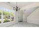Bright entryway featuring sleek tile floors, a staircase, and a large window allowing ample natural light at 2013 Arbor Crest Ct, Charlotte, NC 28262