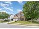 Charming brick two-story home featuring a two-car garage and a small balcony overlooking the front yard at 2013 Arbor Crest Ct, Charlotte, NC 28262