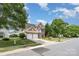 Charming brick two-story home featuring a two-car garage and a small balcony overlooking the front yard at 2013 Arbor Crest Ct, Charlotte, NC 28262