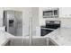 Well-maintained kitchen with stainless steel appliances, marble countertops, and an undermount sink at 2013 Arbor Crest Ct, Charlotte, NC 28262