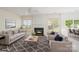 Inviting living room with a fireplace, comfortable seating, and a stylish area rug at 2013 Arbor Crest Ct, Charlotte, NC 28262
