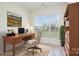 Bright home office with natural light, a wooden desk, and a serene view of the outdoors at 2013 Arbor Crest Ct, Charlotte, NC 28262