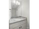 Bathroom featuring a vanity with a light countertop, mirror, and modern fixtures at 208 N Correll St, Landis, NC 28025