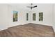Empty bedroom with hardwood floors and three large windows offering plenty of natural light at 2414 E 7Th St, Charlotte, NC 28204