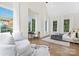 Bright bedroom with large windows, a sitting area, and hardwood floors at 2414 E 7Th St, Charlotte, NC 28204
