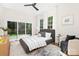 Bedroom featuring a sliding glass door, hardwood floors, and a modern ceiling fan at 2414 E 7Th St, Charlotte, NC 28204