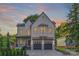 Beautiful two-story home with painted brick, copper accents, a covered porch, and a two-car garage at 2414 E 7Th St, Charlotte, NC 28204