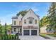 Stunning two-story home with brick facade, two-car garage, and mature trees at 2414 E 7Th St, Charlotte, NC 28204