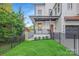 Charming front porch and well-manicured lawn with black fencing for added curb appeal at 2414 E 7Th St, Charlotte, NC 28204