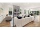 Bright living room features a modern fireplace, plush seating, and hardwood floors at 2414 E 7Th St, Charlotte, NC 28204