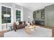 Inviting living room boasts large windows and a stylish built-in bar area at 2414 E 7Th St, Charlotte, NC 28204