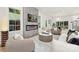 Sun-filled living room with a cozy fireplace, stylish decor, and an inviting atmosphere at 2414 E 7Th St, Charlotte, NC 28204