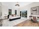 Spacious main bedroom with natural light, hardwood floors, a sitting area, and a large closet at 2414 E 7Th St, Charlotte, NC 28204