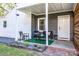 Welcoming back porch with chairs, plants, and a 'Hello' doormat at 2601 Ashley Rd, Charlotte, NC 28208