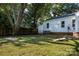 Spacious backyard with lush lawn and mature trees at 2601 Ashley Rd, Charlotte, NC 28208