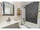 Bathroom features black and white tile with modern fixtures and a stylish vanity at 2601 Ashley Rd, Charlotte, NC 28208