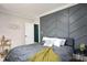 Stylish bedroom features a custom accent wall, wood floors, and elegant decor at 2601 Ashley Rd, Charlotte, NC 28208
