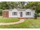 Inviting home features a walkway leading to the front door and updated exterior finishes at 2601 Ashley Rd, Charlotte, NC 28208