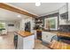 Updated kitchen featuring butcher block counters, modern appliances, and a stylish backsplash at 2601 Ashley Rd, Charlotte, NC 28208