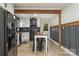 Open concept kitchen with butcher block topped island and dark stainless steel appliances at 2601 Ashley Rd, Charlotte, NC 28208