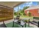 Covered patio with stylish seating and a view of the backyard at 2601 Ashley Rd, Charlotte, NC 28208
