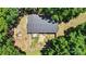 Aerial view of the home's fenced backyard and surrounding trees at 2903 Price Rushing Rd, Monroe, NC 28110
