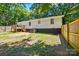Backyard showing privacy fence, deck, and exterior of home at 2903 Price Rushing Rd, Monroe, NC 28110