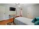 Bedroom featuring a mounted TV and desk on hardwood flooring at 2903 Price Rushing Rd, Monroe, NC 28110