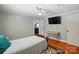 Bedroom showcasing a TV and desk area on hardwood floors at 2903 Price Rushing Rd, Monroe, NC 28110