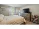 Comfortable bedroom featuring natural light, wood dresser and flooring at 2903 Price Rushing Rd, Monroe, NC 28110