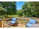 Relaxing deck featuring cushioned chairs and a tranquil backyard view at 2903 Price Rushing Rd, Monroe, NC 28110