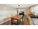 Open concept dining area featuring hardwood floors and seamlessly connects to a cozy living room with entertainment center at 2903 Price Rushing Rd, Monroe, NC 28110