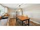 Eat-in kitchen featuring modern appliances, hardwood floors, custom cabinets, and plenty of natural light throughout at 2903 Price Rushing Rd, Monroe, NC 28110