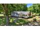Wonderful home with a walkway, established trees, and a porch with seating for enjoying the outdoor scenery at 2903 Price Rushing Rd, Monroe, NC 28110