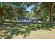 Serene home with shade trees, manicured lawn, a quaint front porch, offering a peaceful and inviting atmosphere at 2903 Price Rushing Rd, Monroe, NC 28110