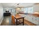 Open concept kitchen with butcher block countertops and modern lighting at 2903 Price Rushing Rd, Monroe, NC 28110