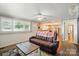 Comfortable living room featuring a door to the exterior and open access to kitchen at 2903 Price Rushing Rd, Monroe, NC 28110