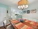 Dining room with hardwood floors and a view into the kitchen at 2911 Butter Churn Ln, Matthews, NC 28105