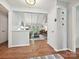 Bright foyer with hardwood floors and a view into the living room with vaulted ceilings at 2911 Butter Churn Ln, Matthews, NC 28105