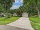 Charming single-story home with a well-manicured lawn and a spacious driveway at 2911 Butter Churn Ln, Matthews, NC 28105