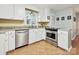Bright kitchen with stainless steel appliances, white cabinets, and granite countertops at 2911 Butter Churn Ln, Matthews, NC 28105