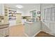 Kitchen with tile floors, stainless steel appliances, white cabinets and breakfast nook at 2911 Butter Churn Ln, Matthews, NC 28105