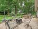 Spacious patio with outdoor seating, a fire pit, and landscaped backyard at 2911 Butter Churn Ln, Matthews, NC 28105