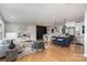 Open-concept design showcasing the living room, dining area, and kitchen with stainless steel appliances at 300 Dollar Cir, Charlotte, NC 28270