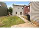 Townhome backyard with grass area and patio at 3039 Potomac River Pkwy, Charlotte, NC 28217