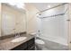 Well-lit bathroom featuring a tiled shower and granite vanity at 3039 Potomac River Pkwy, Charlotte, NC 28217